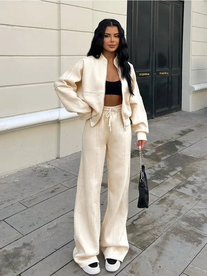 CONJUNTO DEPORTIVO CASUAL MUJER CON CHAQUETA CREMALLERA Y PANTALÓN ACAMPANADO