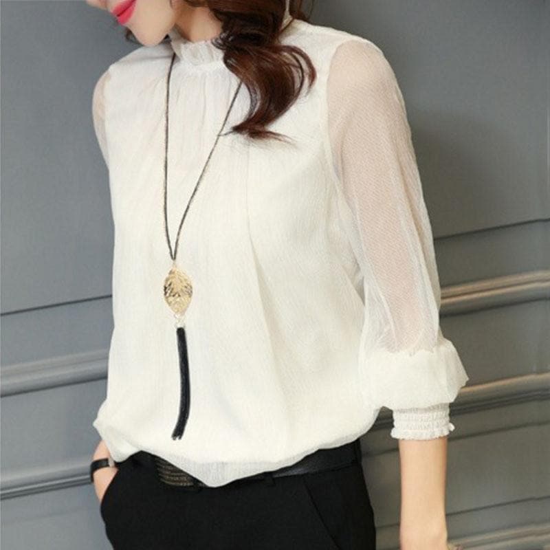 BLUSA CON VOLANTES Y MANGAS TRANSPARENTES – FEMINIDAD Y ESTILO