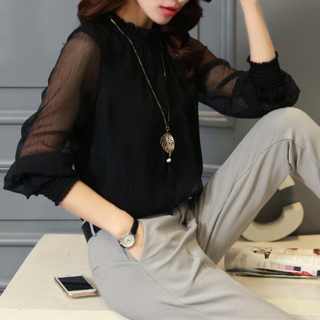 BLUSA CON VOLANTES Y MANGAS TRANSPARENTES – FEMINIDAD Y ESTILO